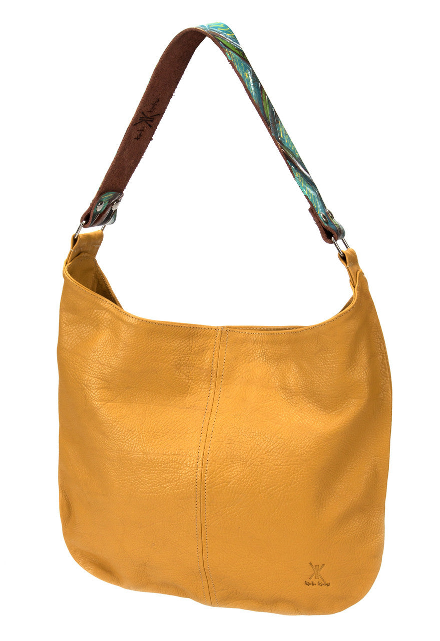 Dimensions: 13” x 16” Liner: Canvas Closure: Magnetic Snap Hardware: Nickel -One 7” zippered pocket inside -Two lined pockets inside -Two lined pockets outside