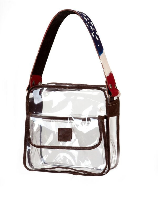 Cile Brown Small Clear Bag
	⁃	Brown Leather Piping
	⁃	Dimensions 9“ x 9“ x 3”
	⁃	Nickel hardware with Brown Nylon Zipper Closure
	⁃	6“ x 9“ x 1“ Outside Magnetic Closure Pocket