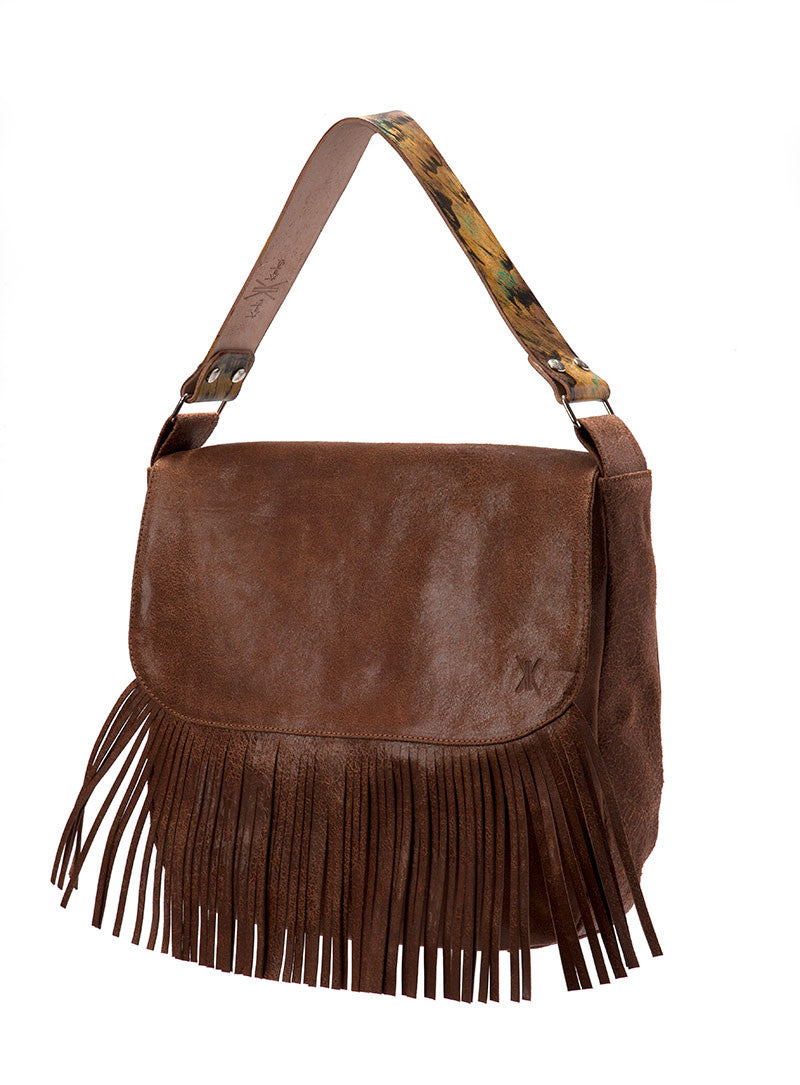 The Nicole Eclectic handbag comes in Black Brown and Mustard Eclectic leather. It is fully lined and features three interior pockets. It uses a magnetic snap closure.

Dimensions: 12.50" x 12.50” x 7"
Closure: magnetic
One 7" zipper pocket inside
Two lined pockets inside
Bone Duck Canvas liner
Nickel Fee