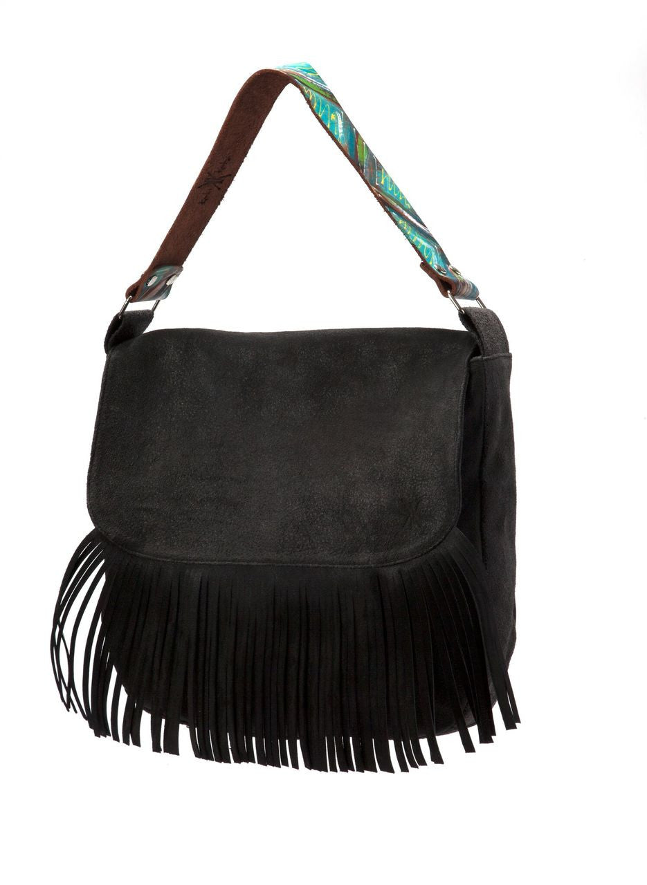 The Nicole Eclectic handbag comes in Black Brown and Mustard Eclectic leather. It is fully lined and features three interior pockets. It uses a magnetic snap closure.

Dimensions: 12.50" x 12.50” x 7"
Closure: magnetic
One 7" zipper pocket inside
Two lined pockets inside
Bone Duck Canvas liner
Nickel Fee